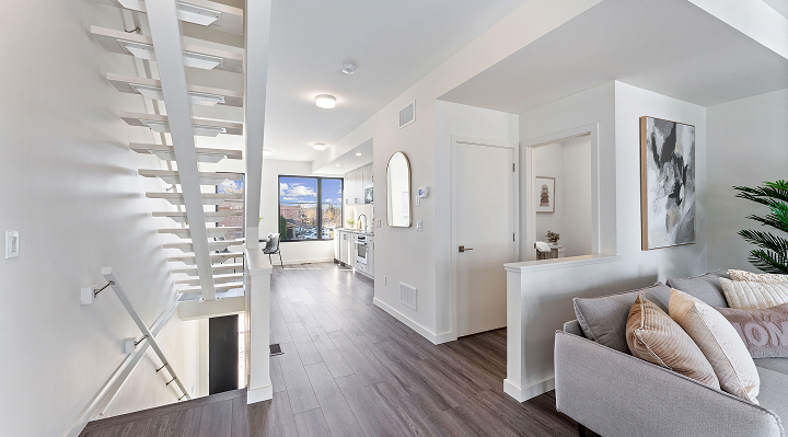 Stylish interior with open staircase and spacious living area