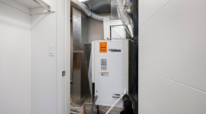 Mechanical room with energy efficient heating and cooling equipment